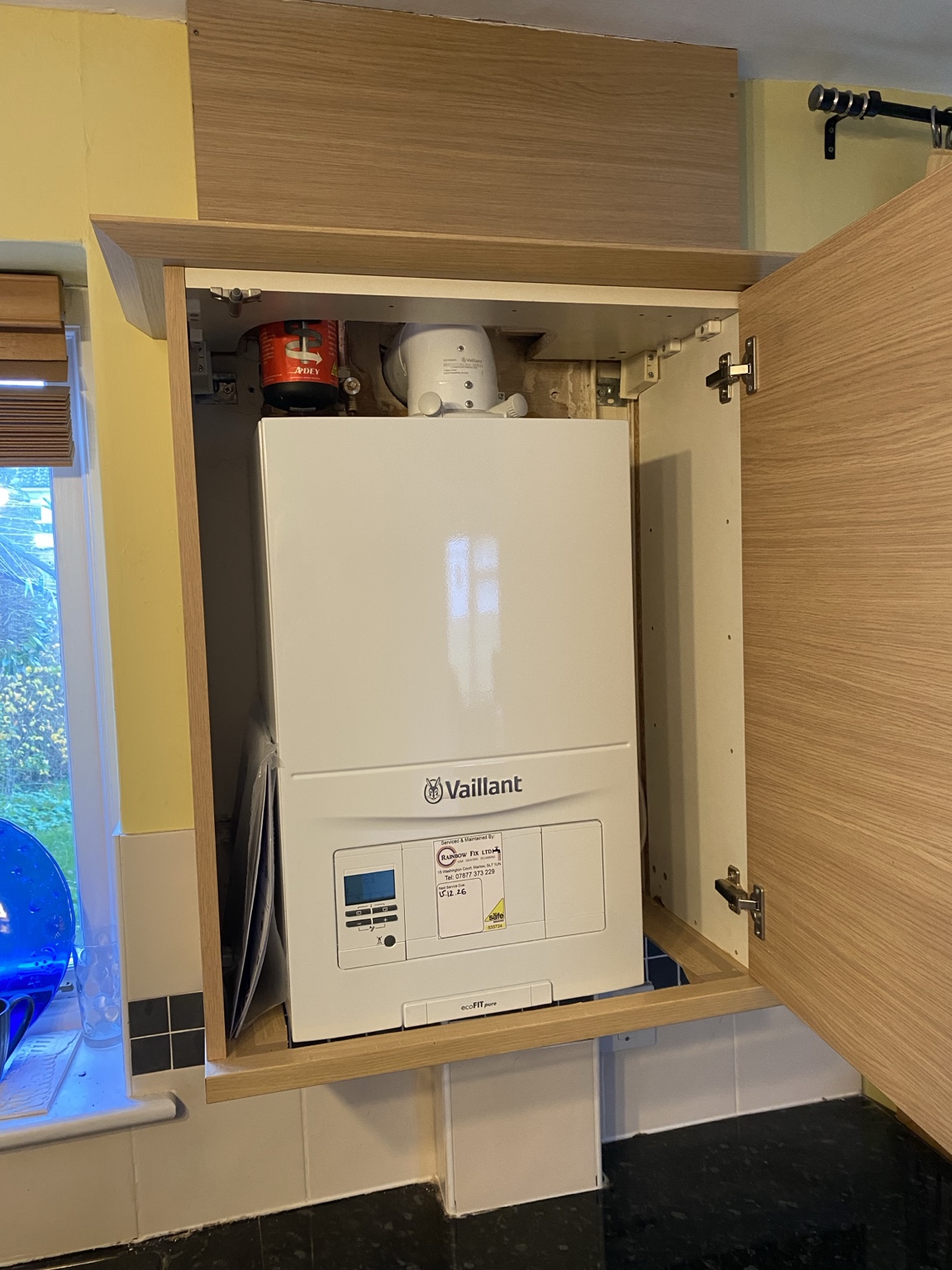 Vaillant boiler installed inside kitchen cabinet